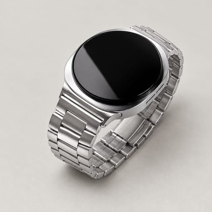 The Meridian in Silver worn on the wrist with a dark suit