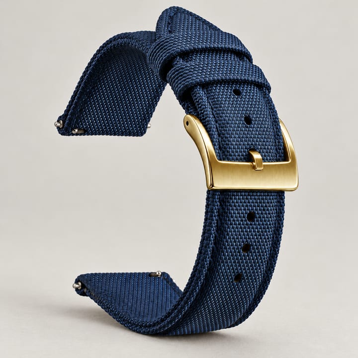 The Halyard woven nylon watch band in navy with a gold-tone buckle and quick-release spring bars