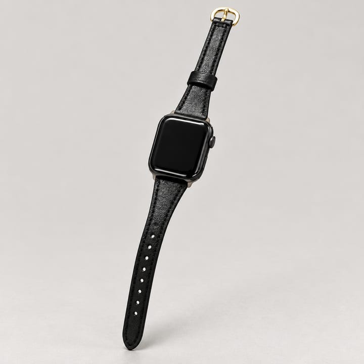 The Ribbon in Black/Gold, with a gold-tone buckle