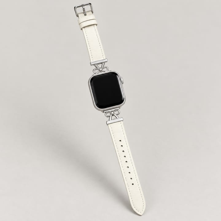 The Atelier in Ivory with a polished silver-tone bow at each end of the case