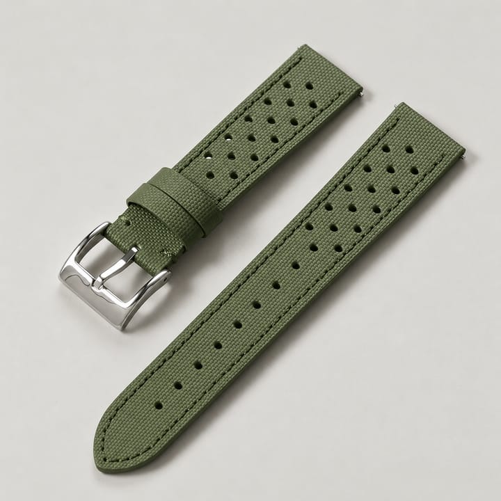The Rally in Olive: perforated olive sailcloth watch strap with a silver-tone buckle