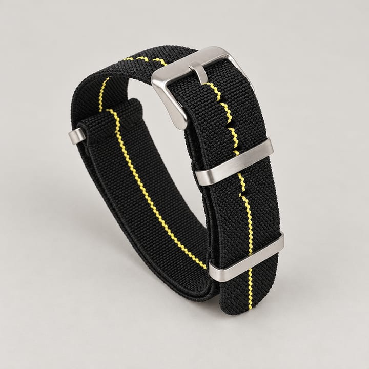 The Parachute Elastic NATO Strap, Black with yellow stripe and steel hardware