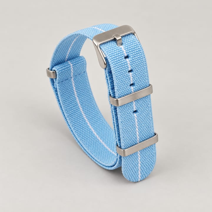 The Parachute Elastic NATO Strap, Sky blue with white stripe and steel hardware