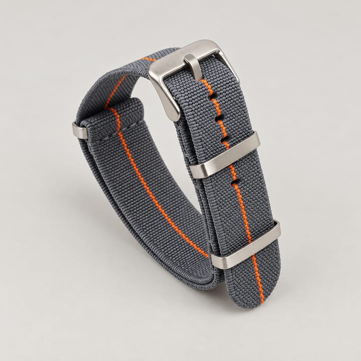 The Parachute Elastic NATO Strap, Dark gray with orange stripe and steel hardware