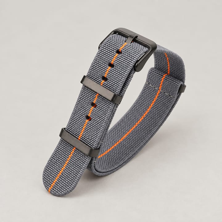 The Parachute Elastic NATO Strap, Dark gray with orange stripe and black hardware