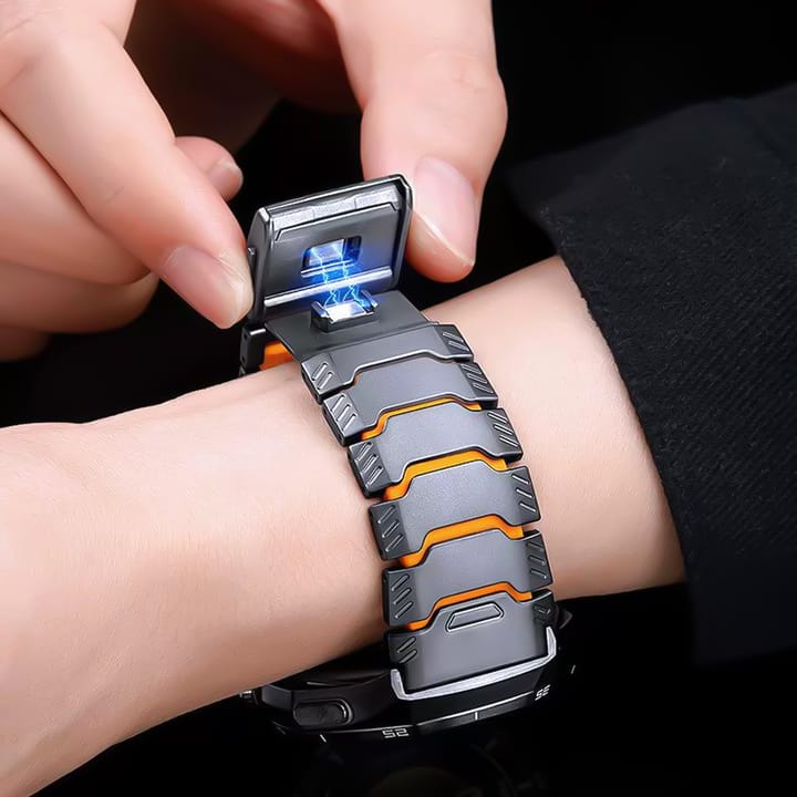 Opening the magnetic clasp of the black and orange titanium band on a wrist