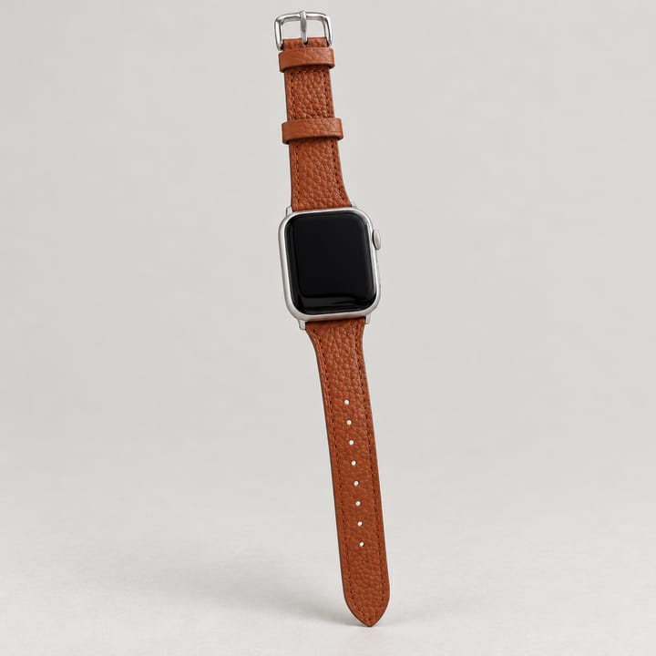 The Ribbon in Brown, with its pebbled grain, held up by the buckle