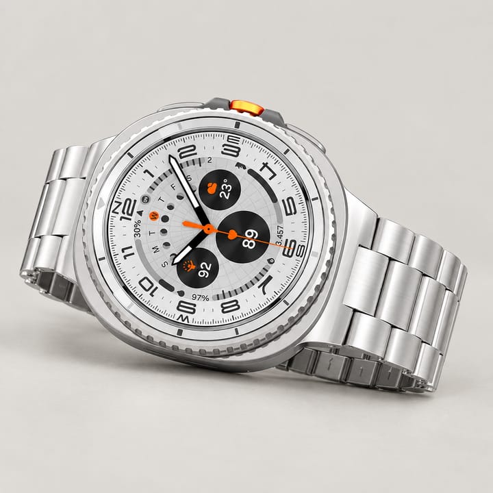 The Meridian steel link band in Silver on a round smartwatch resting on a book