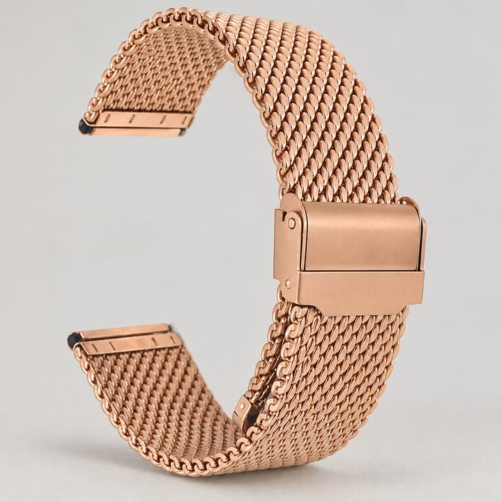 The Heavy Mesh in rose gold, curved as it sits on the wrist with the clasp closed