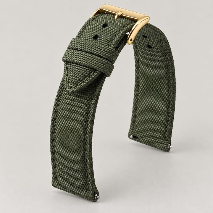 The Jib in Olive/Gold: olive sailcloth watch band with a gold-tone buckle