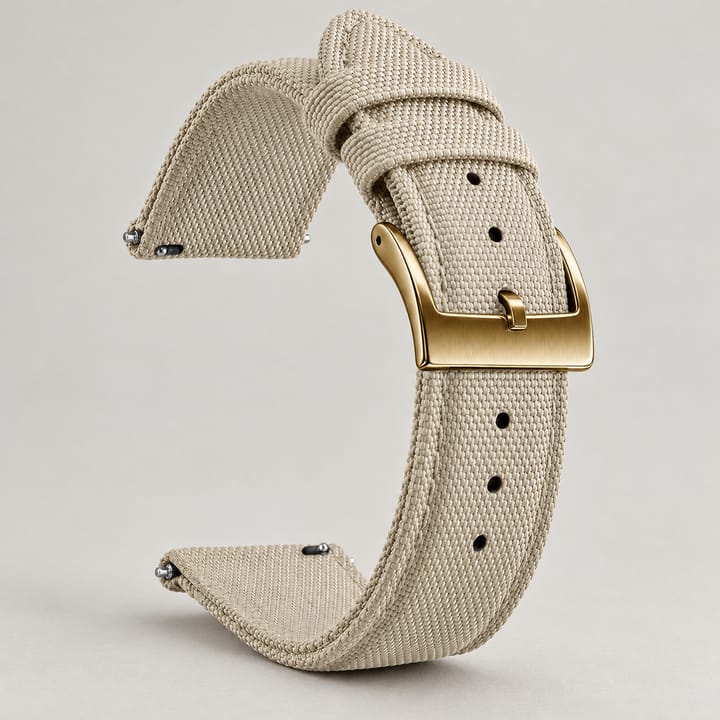 The Halyard woven nylon watch band in beige with a gold-tone buckle and quick-release spring bars