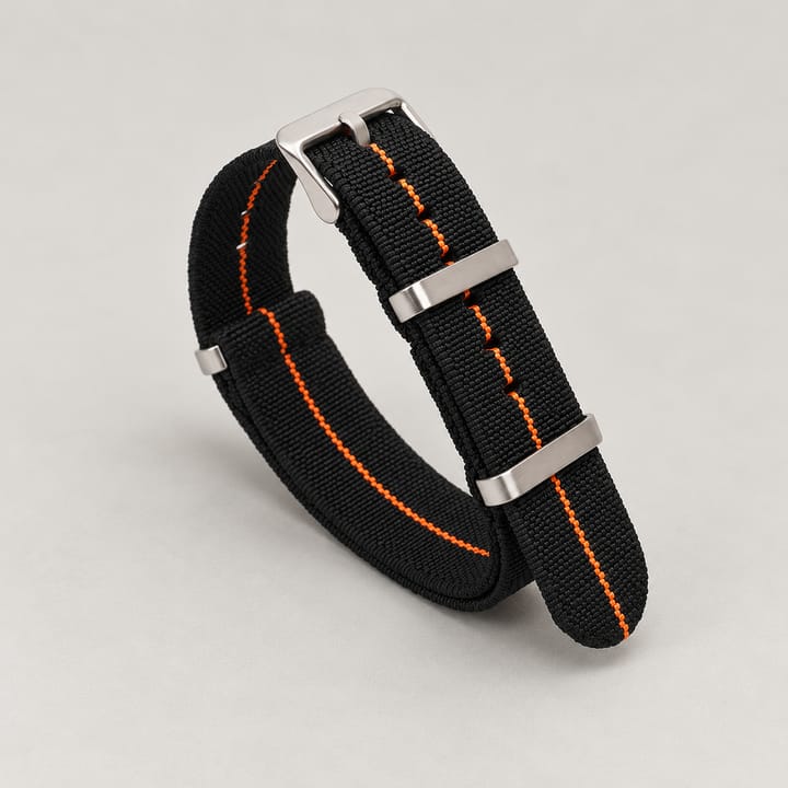The Parachute Elastic NATO Strap, Black with orange stripe and steel hardware